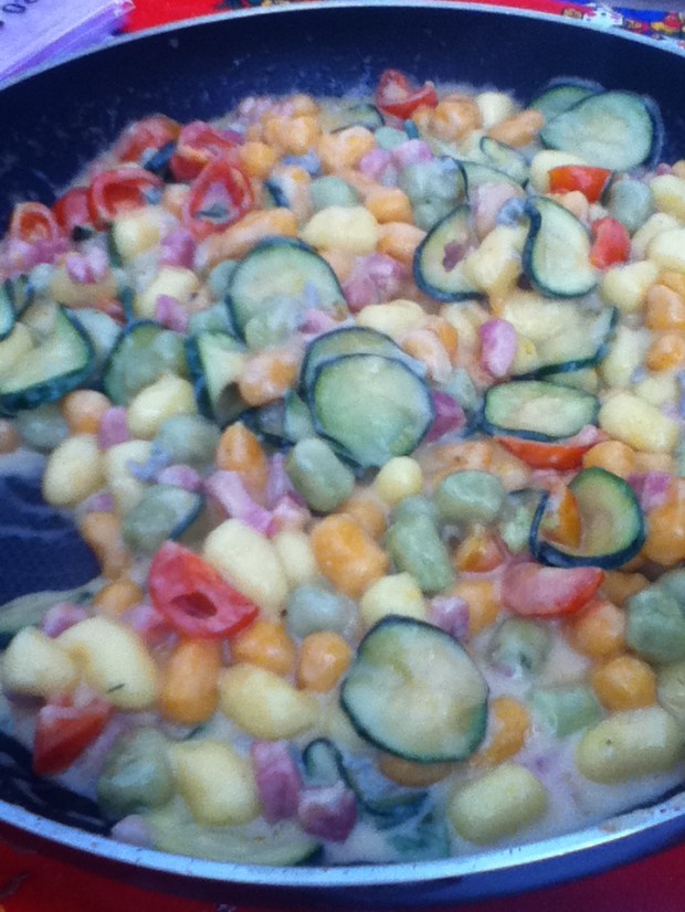 Colorful gnocchi with gorgonzola cheese and veggies